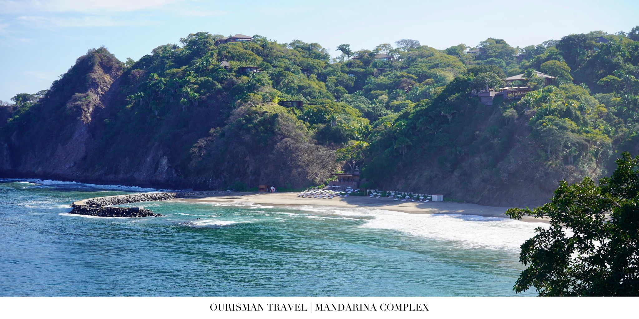 Aerial view over lush jungle and ocean at Mandarina with beachfront One&Only and Rosewood hotels in Riviera Nayarit