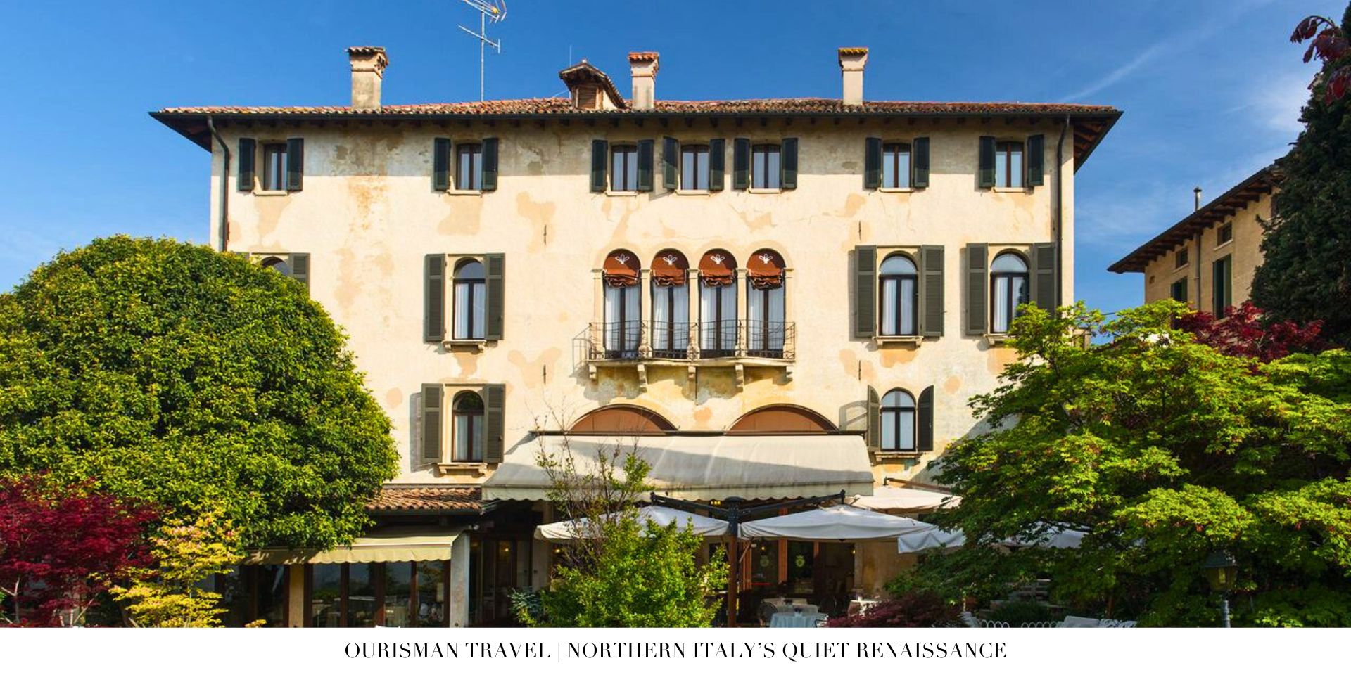Lake Como hotel terrace overlooking calm waters and hillside villages
