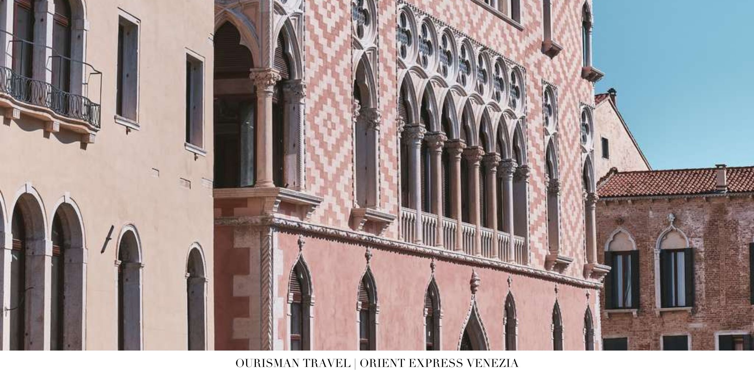 25. Exterior view of Orient Express Venice Hotel along a canal