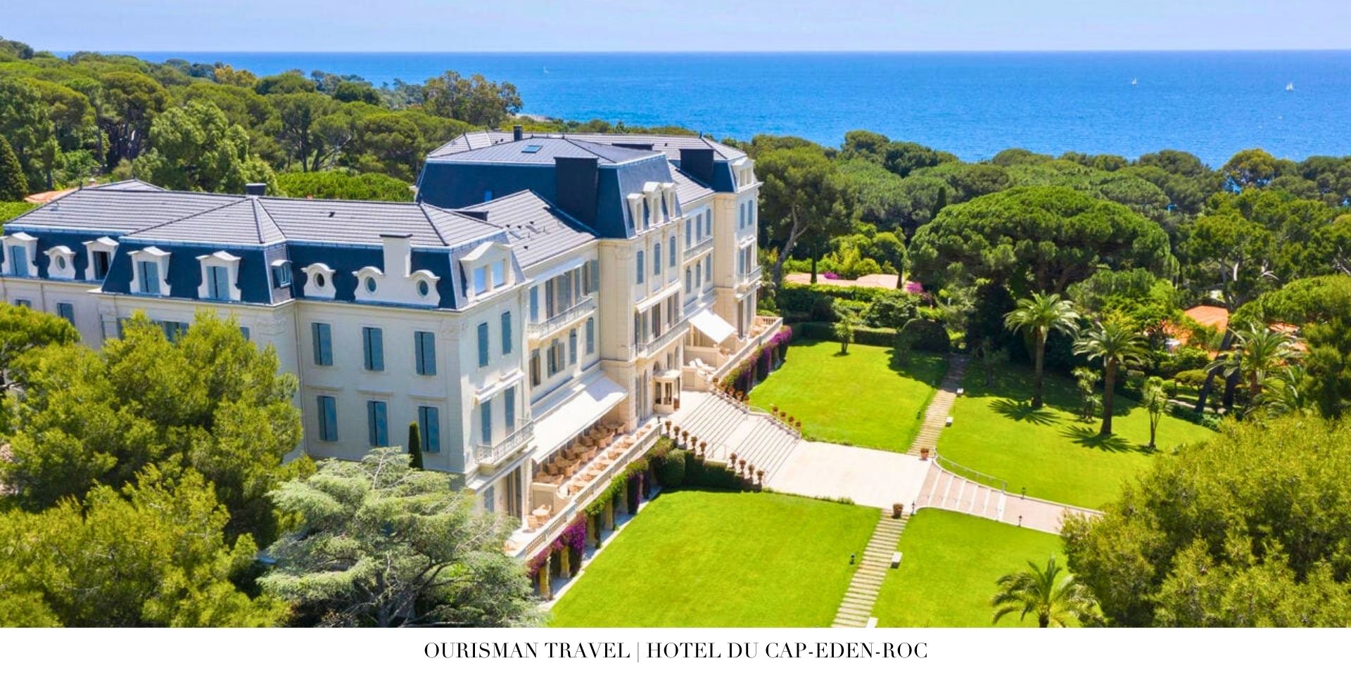 Panoramic exterior view of Hotel du Cap-Eden-Roc with lush gardens and sparkling coastline