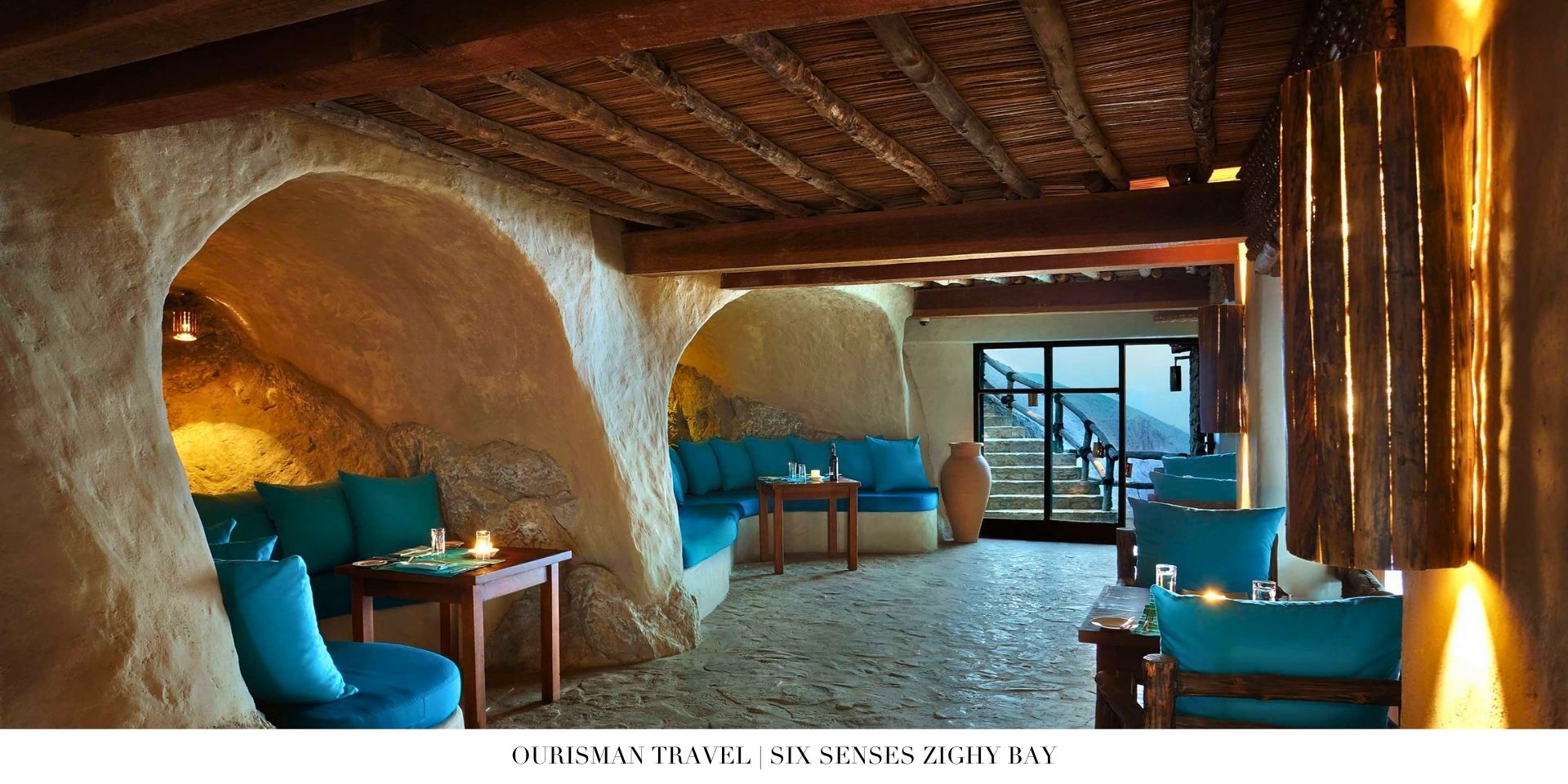 Cave dining at Six Senses Zighy Bay set against mountains and beachfront scenery