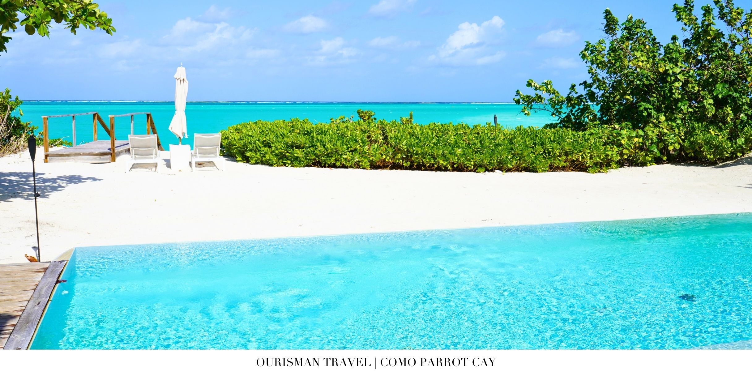 Oceanfront infinity pool at COMO Parrot Cay with white sand beach and clear Caribbean sea