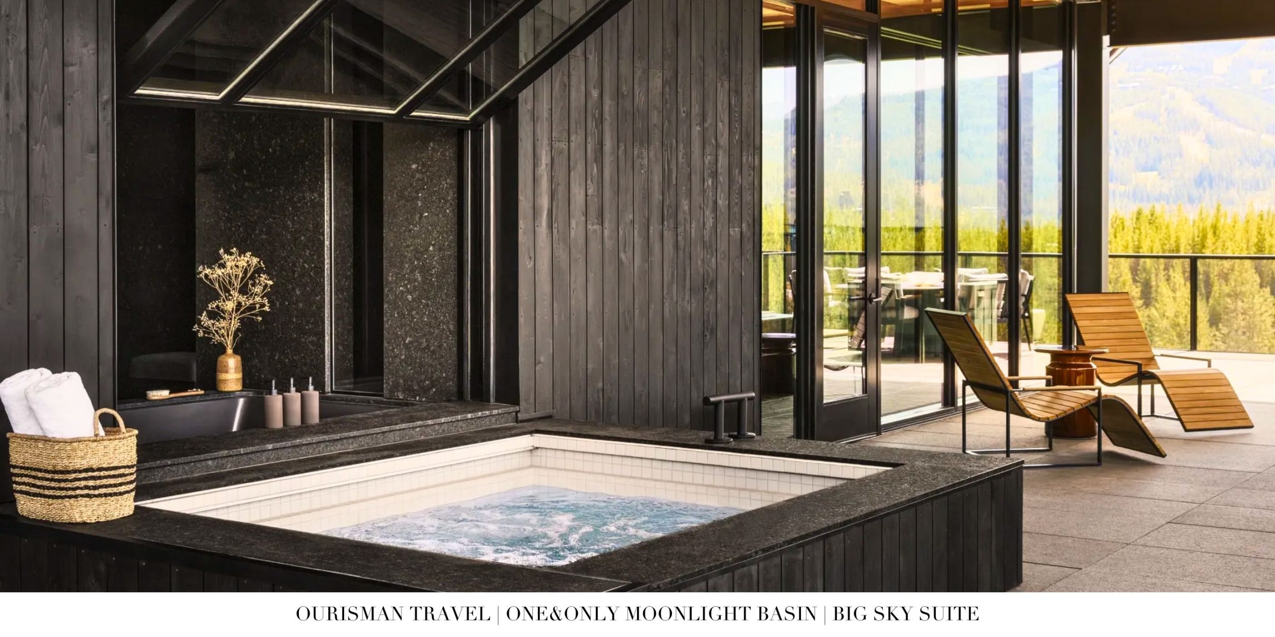 Living room inside the Big Sky Suite at One&Only Moonlight Basin showcasing a stone fireplace, custom furnishings, and refined mountain décor.