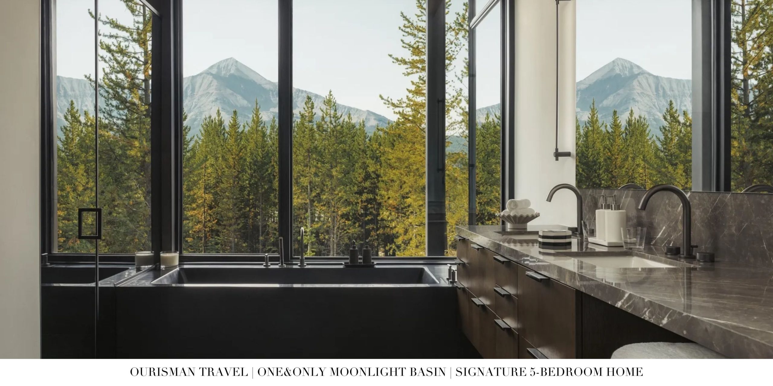 Spa-inspired bathroom inside a private home at One&Only Moonlight Basin featuring a deep soaking tub, walk-in shower, dual vanities, and natural stone finishes in a refined alpine setting.