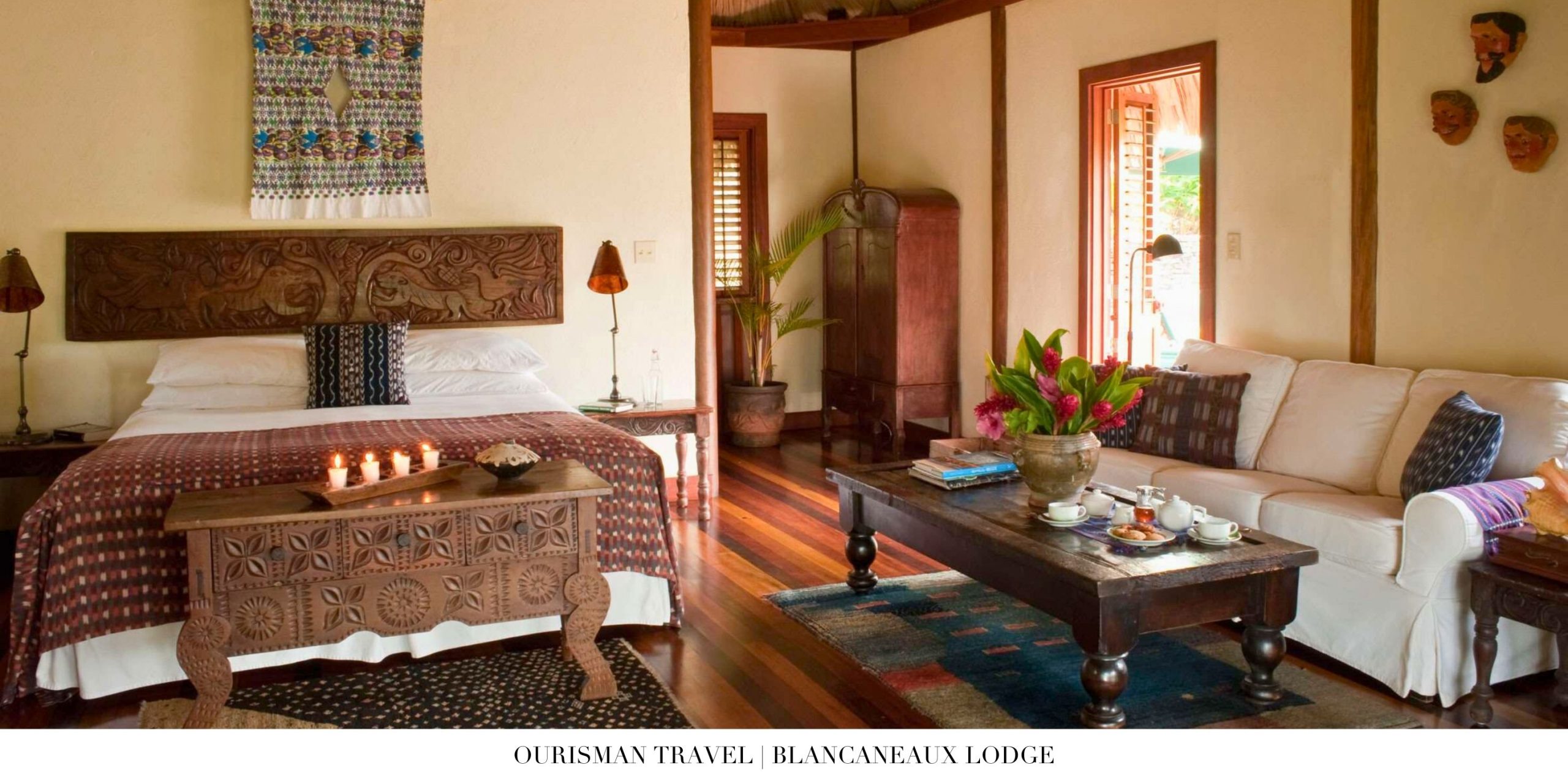 Interior of a luxury suite at Blancaneaux Lodge with rainforest views and tropical décor