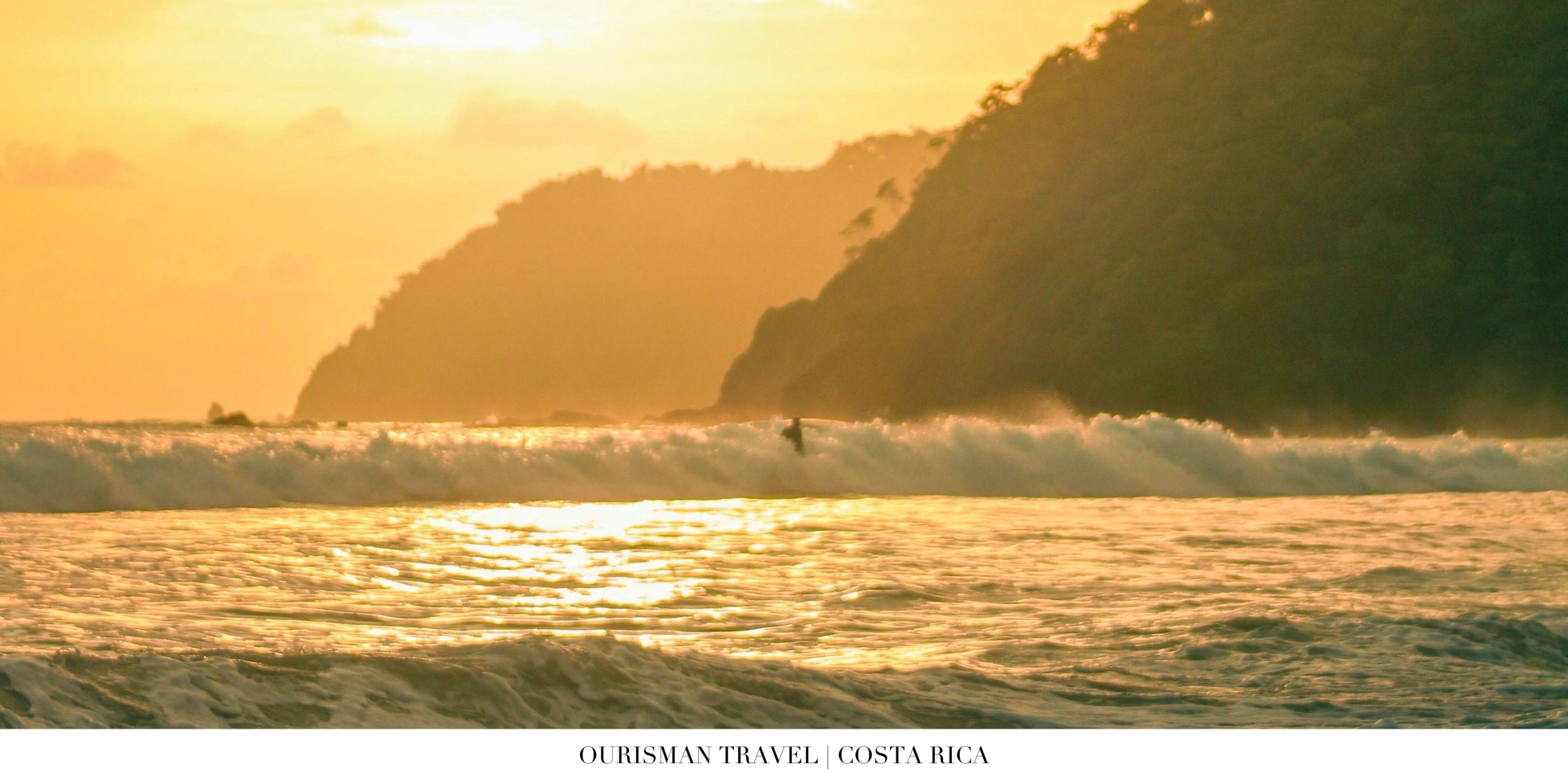 Surfer riding a turquoise wave on Costa Rica’s Pacific coast