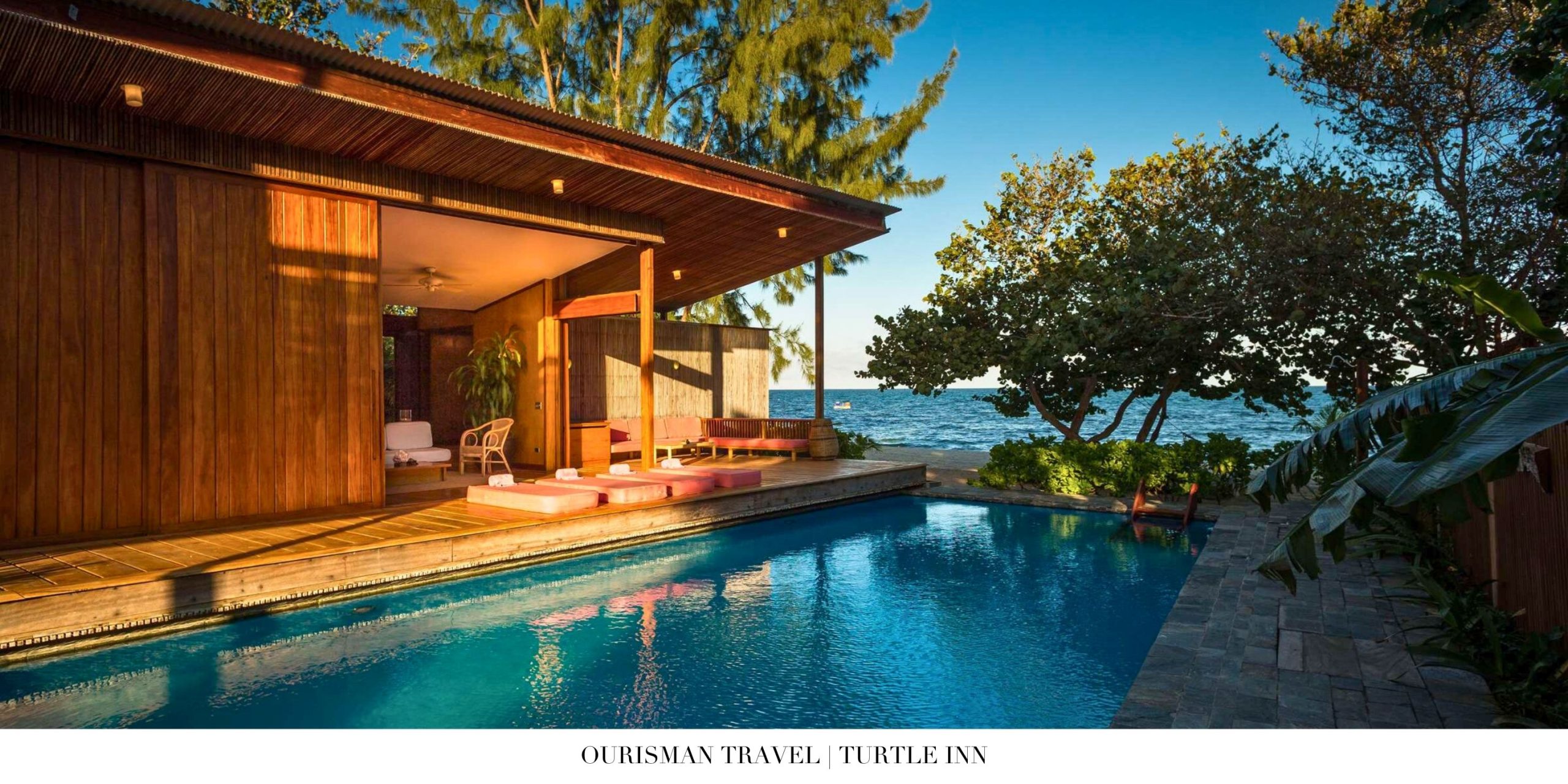 Interior of Turtle Inn suite with Caribbean-inspired décor and king bed