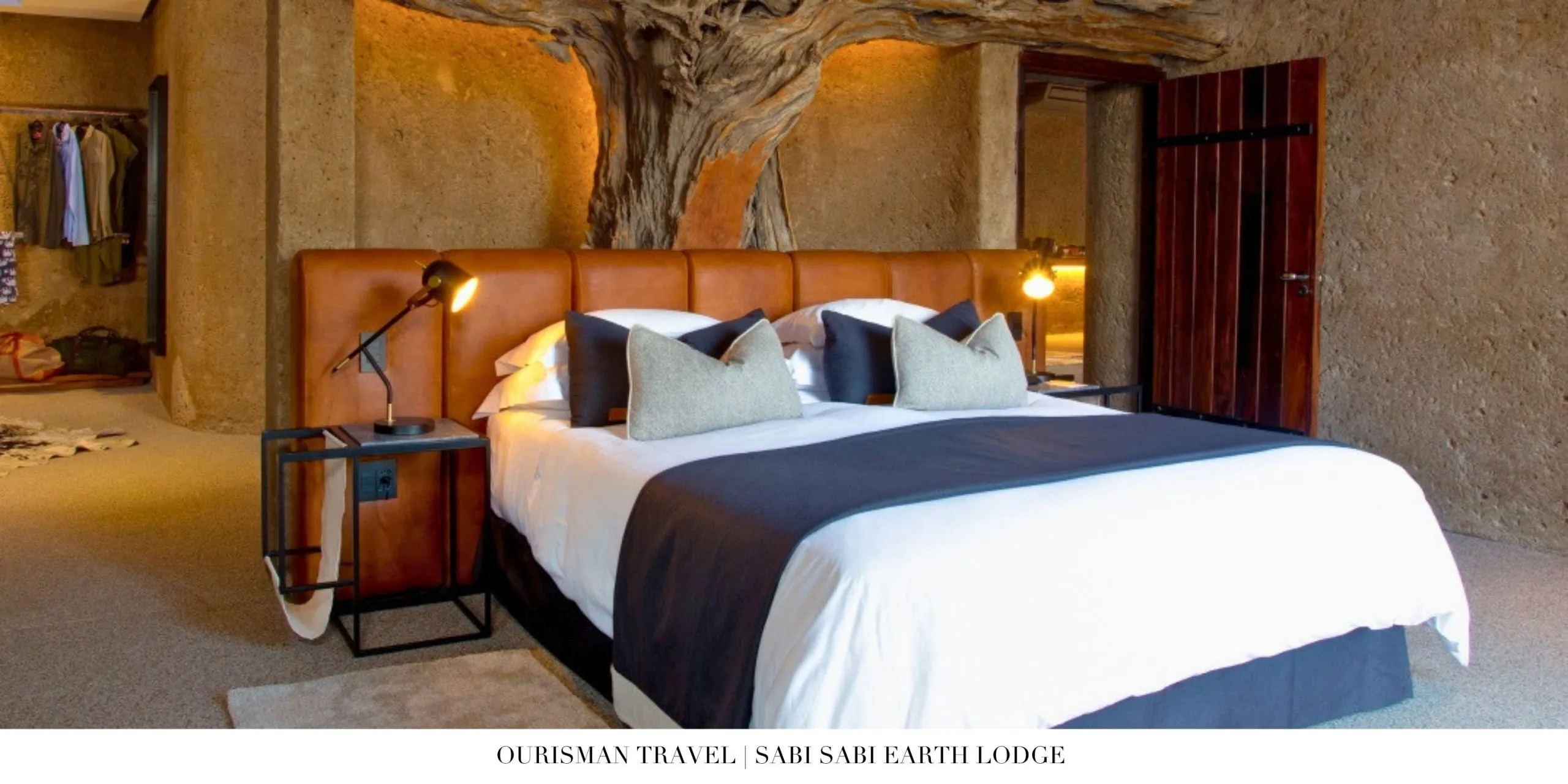 Spacious luxury suite interior at Sabi Sabi Earth Lodge with earthy tones