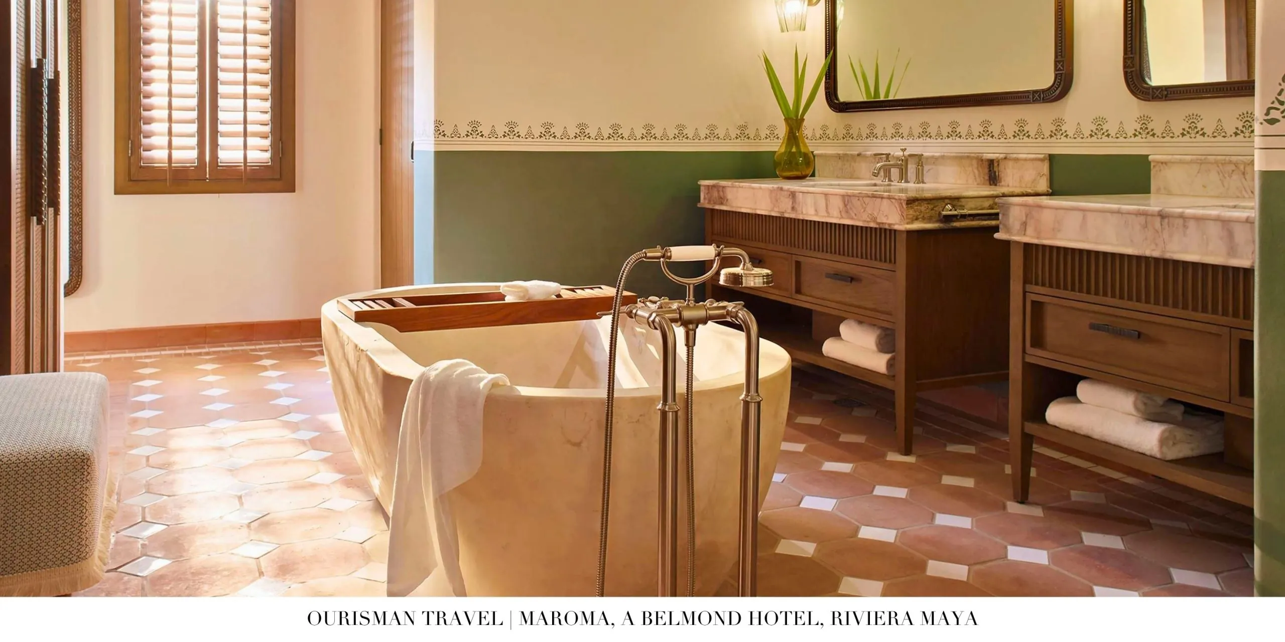 Bathroom with natural light and luxury amenities at Maroma