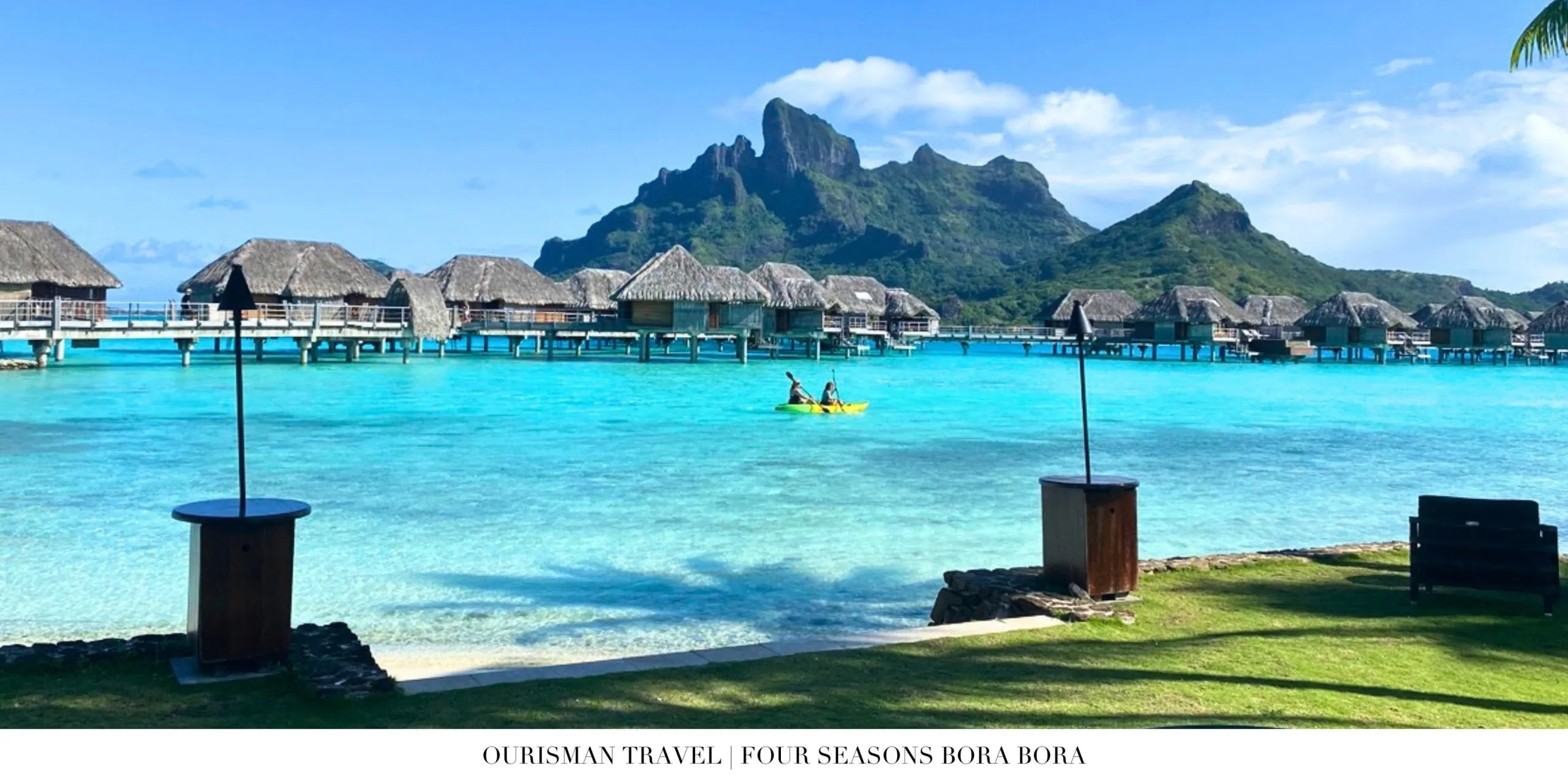 Calm lagoon with overwater villas in Bora Bora