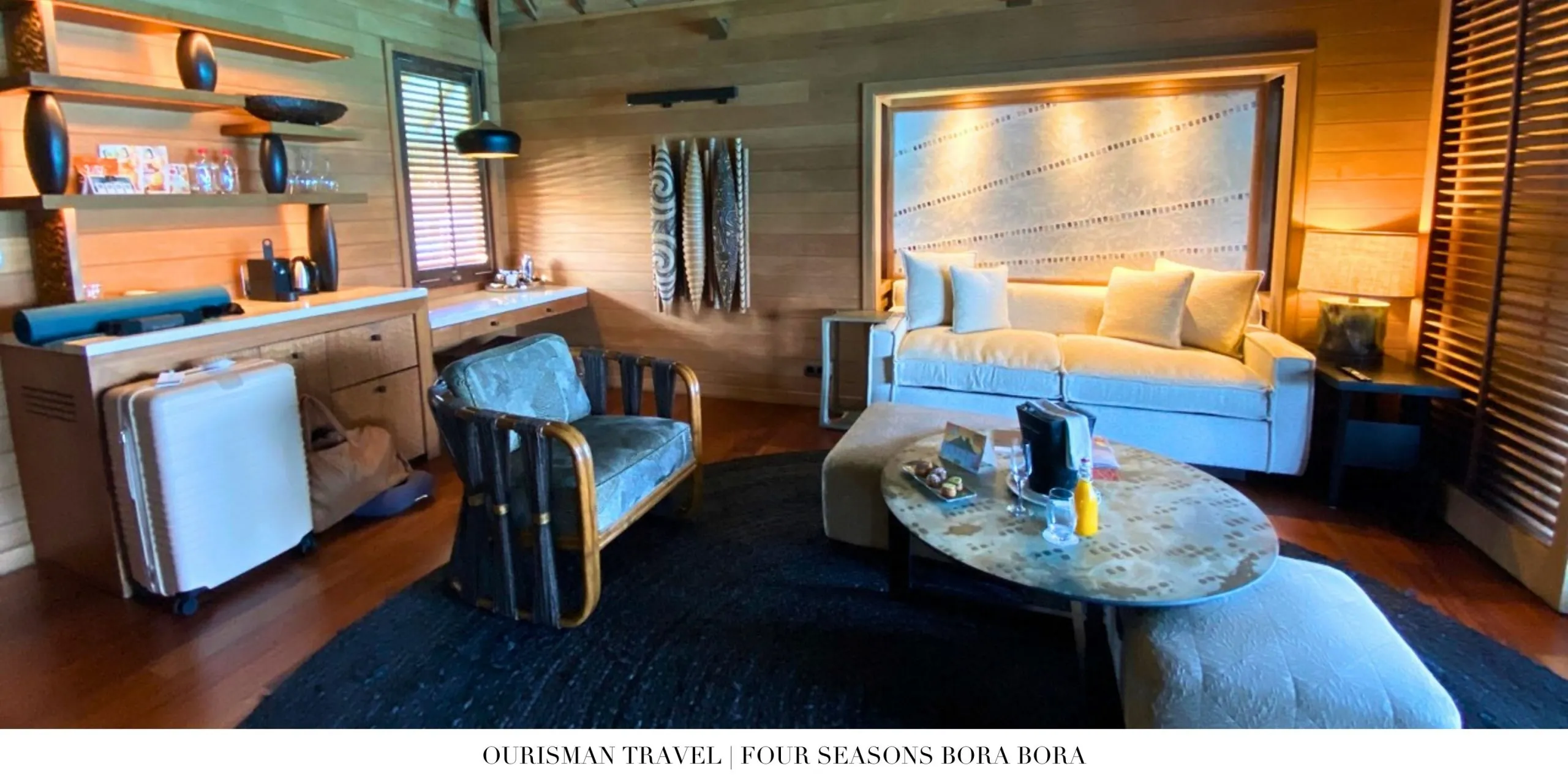 Thatched-roof overwater villas at Four Seasons Resort Bora Bora