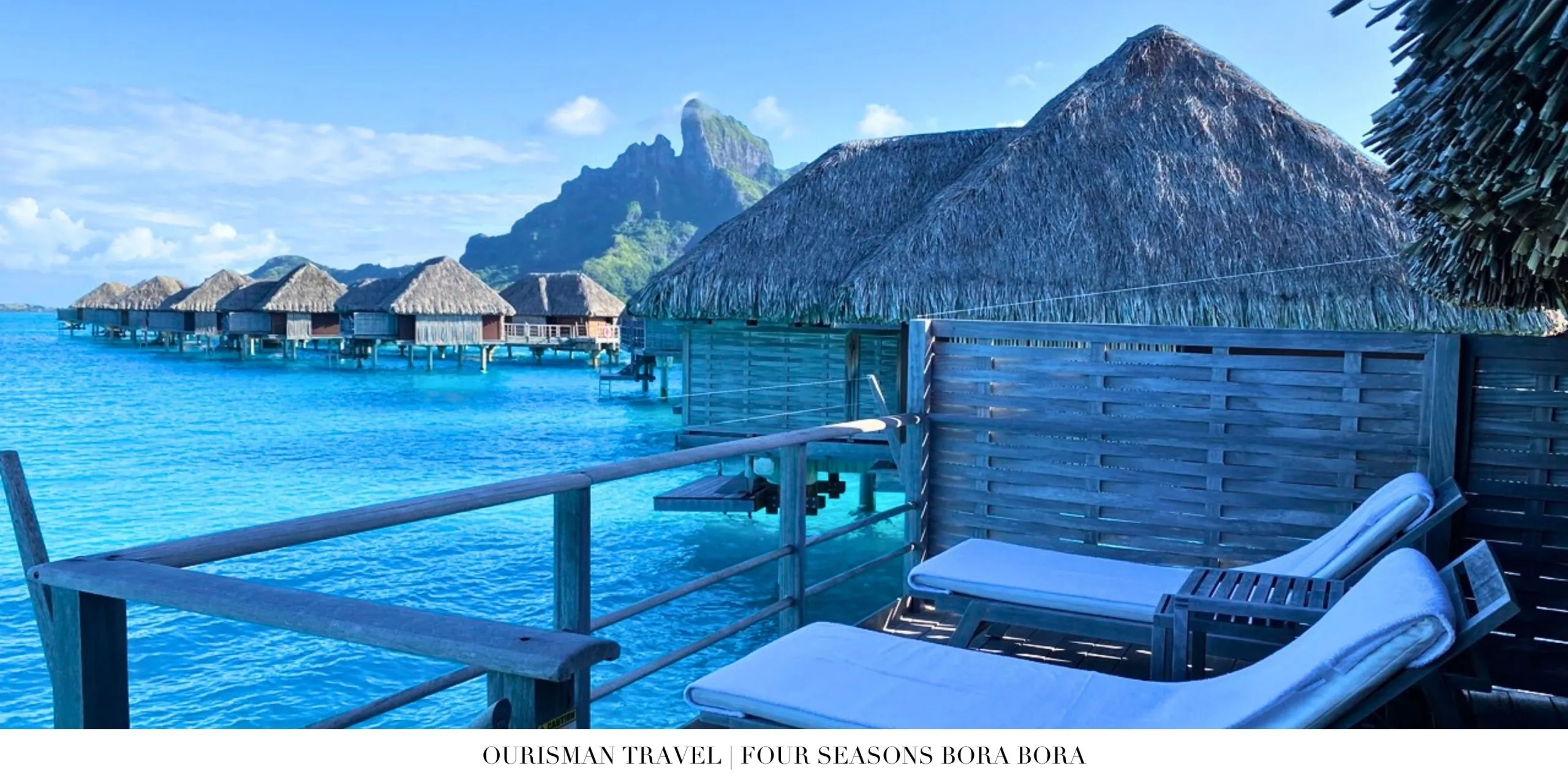 Thatched-roof overwater villas at Four Seasons Resort Bora Bora