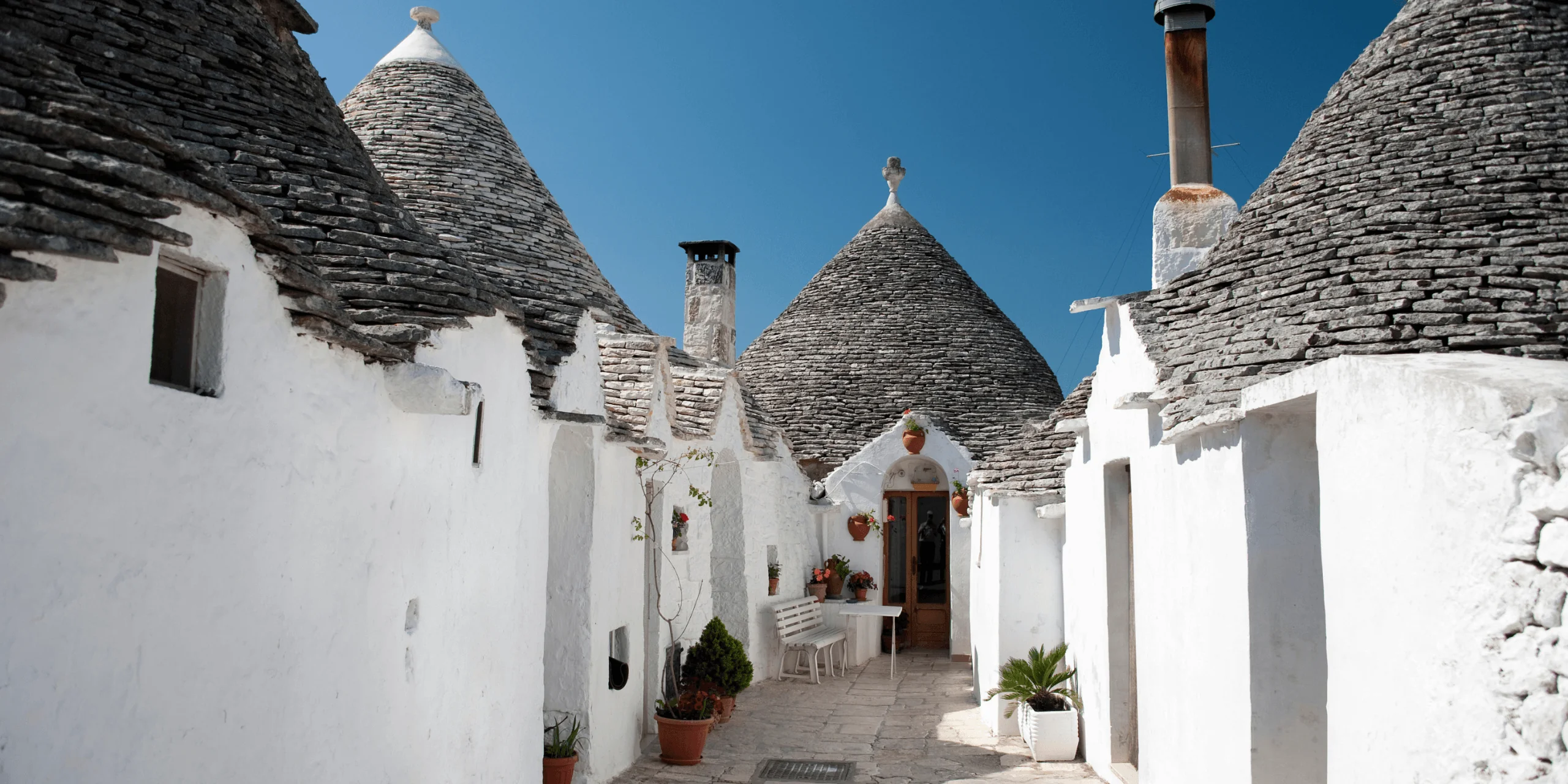 Trulli street in Puglia Italy with white buildings