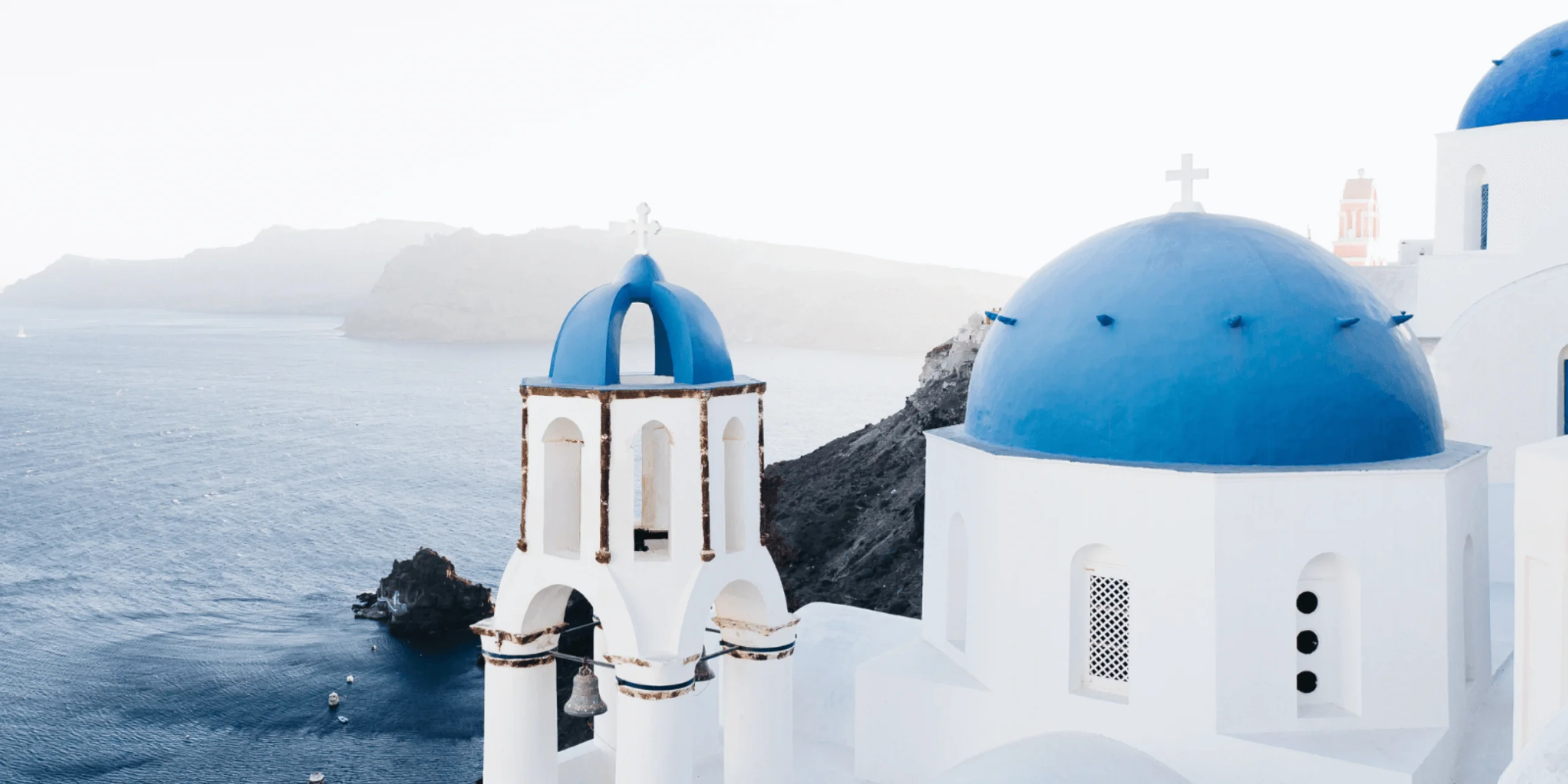 Blue dome church in Santorini Greece
