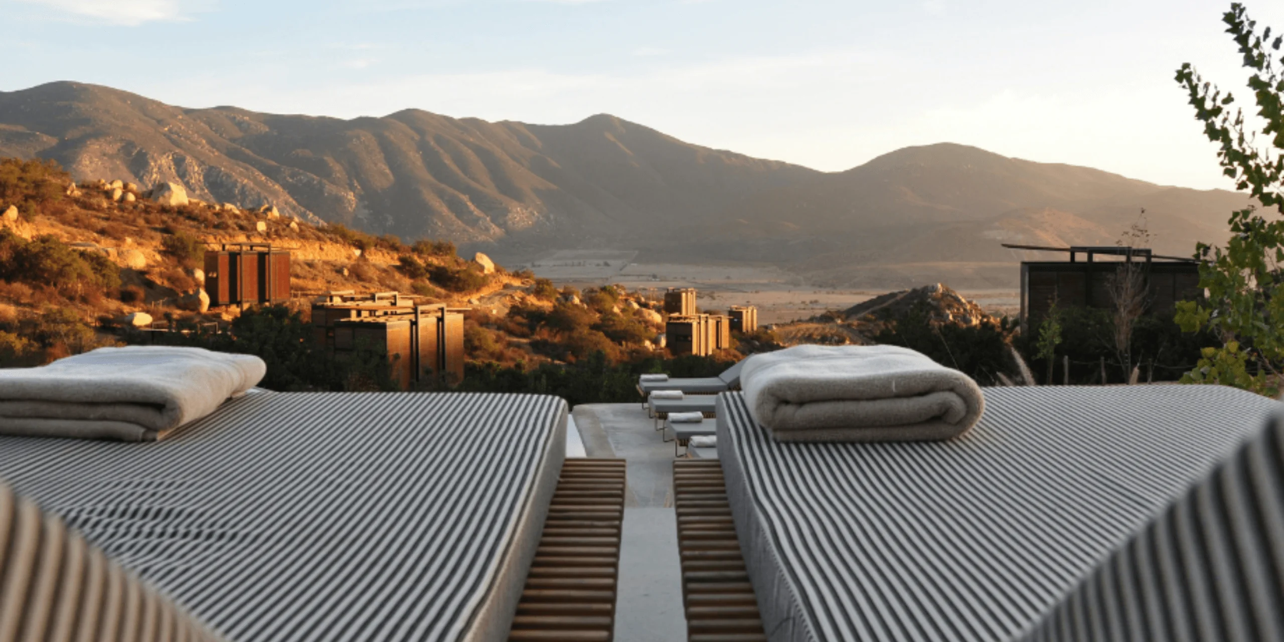 Outdoor daybeds with mountain view at sunset