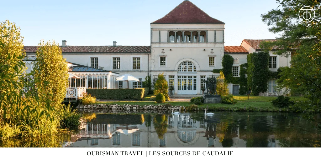 Exterior view of Les Sources de Caudalie with reflecting pond in Bordeaux wine country