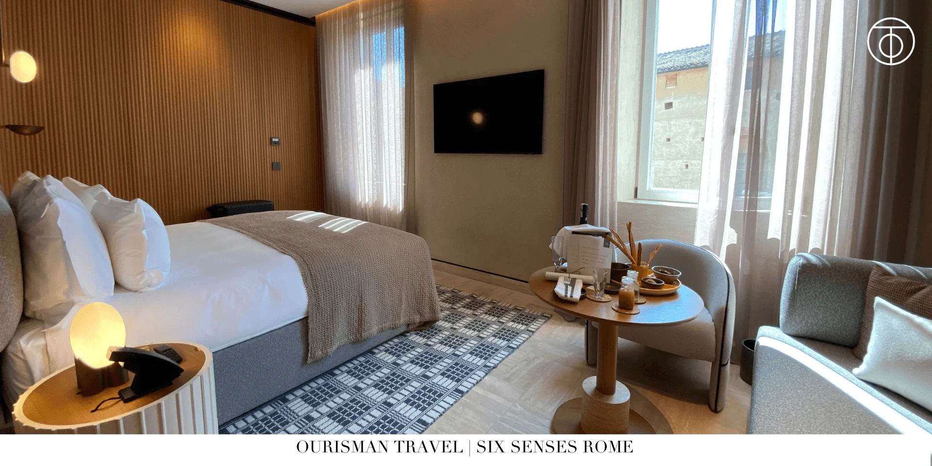 Bedroom at Six Senses Rome signature suite with king bed and modern Italian design