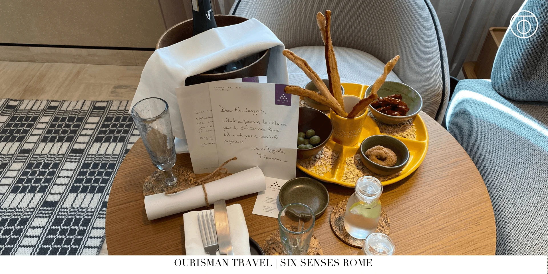 Welcome amenity at Six Senses Rome with champagne and fresh juice in a modern hotel suite
