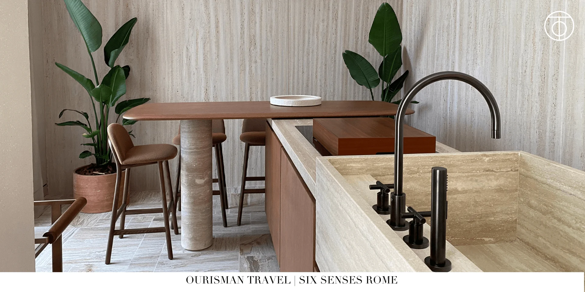 In-suite kitchen at Six Senses Rome with dining table and minimalist design