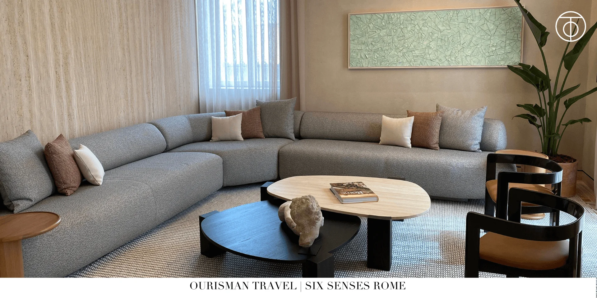 Living room in Six Senses Rome signature suite with sofa and city view