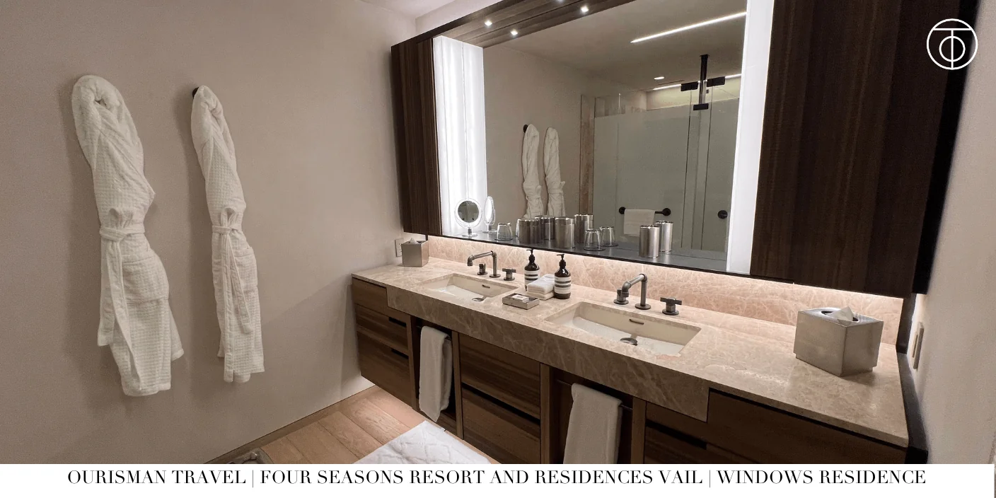 Double vanity in marble bathroom at Windows Residence