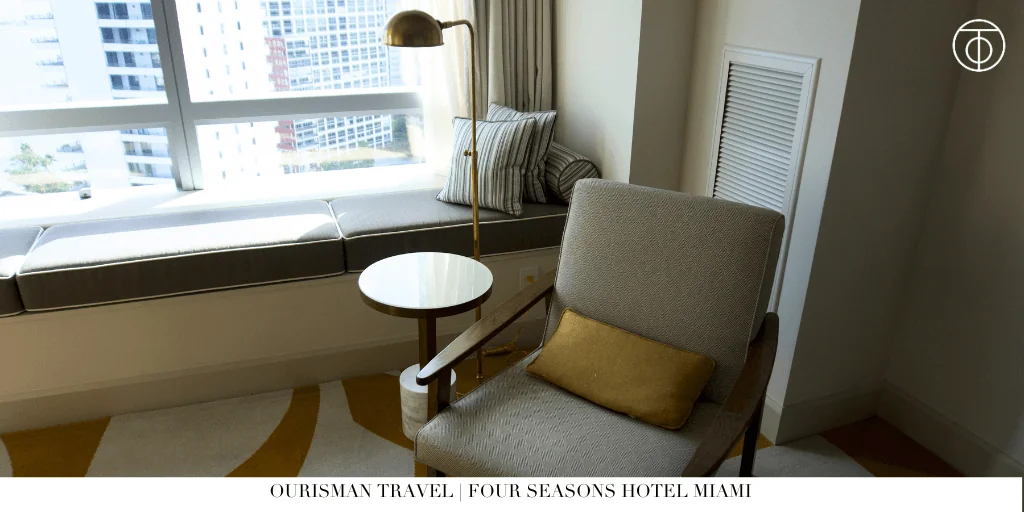 Premier Bayfront Room seating area at Four Seasons Hotel Miami with city views.