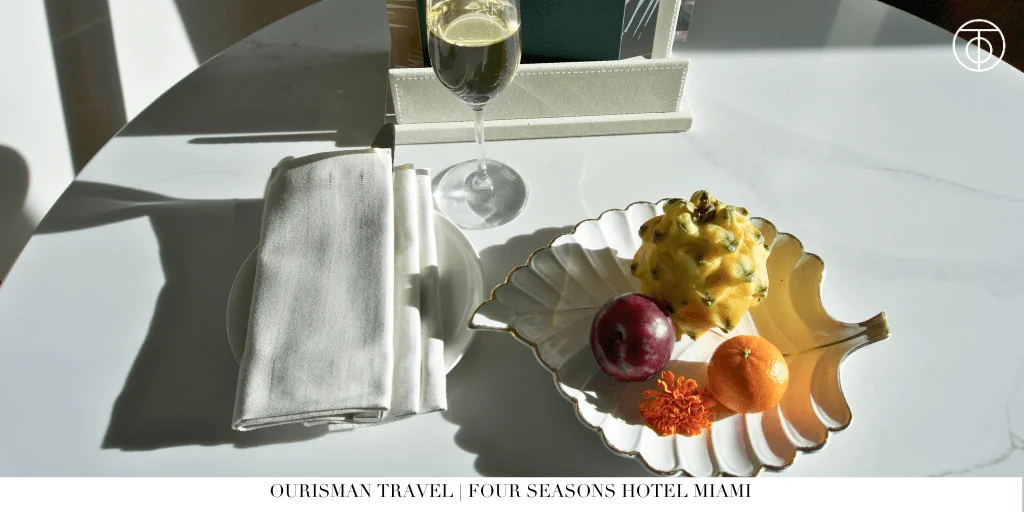 Welcome fruit tray and champagne in a Premier Bayfront Room at Four Seasons Hotel Miami.
