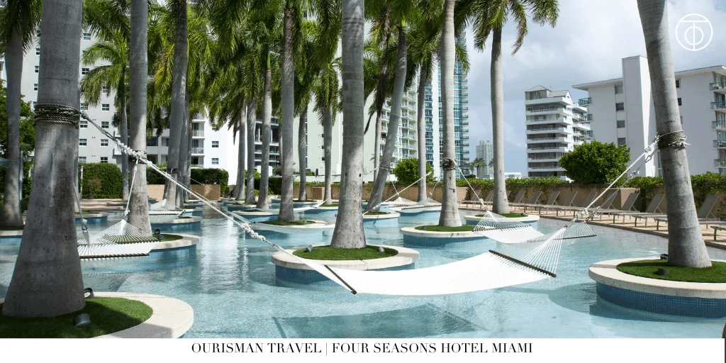 Palm-lined rooftop pool at Four Seasons Hotel Miami in Brickell.