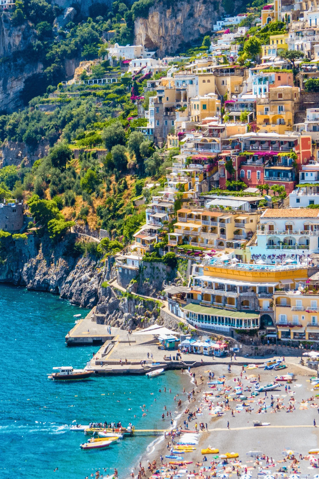 Colorful cliffside buildings overlooking the beach and sea in Positano on the Amalfi Coast in Italy