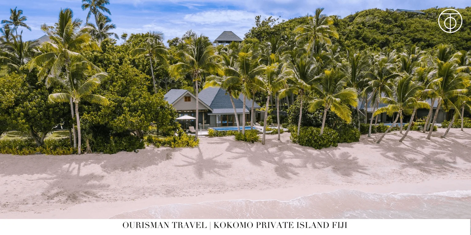 Kokomo Private Island beachfront villa with palm trees Fiji