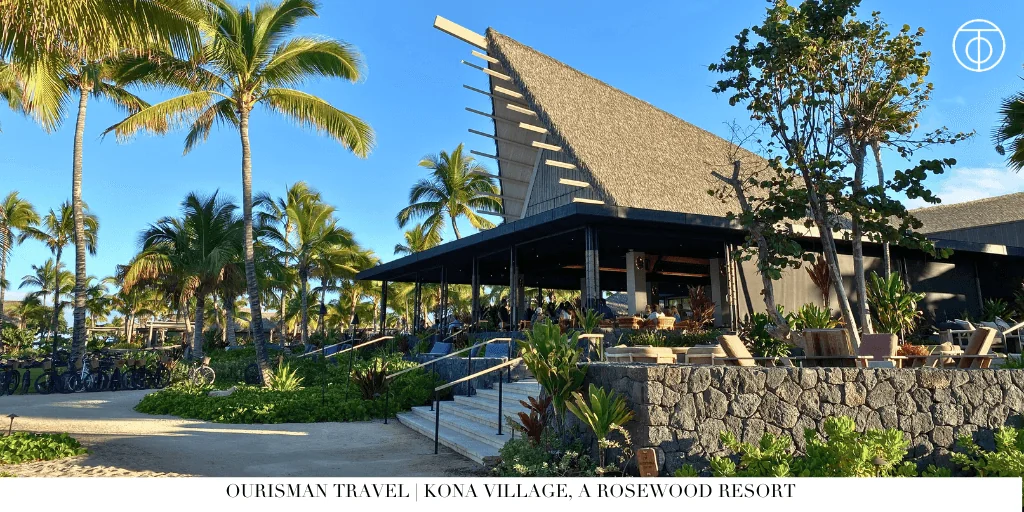 Tropical resort building with palm trees at Kona Village a Rosewood Resort on the Big Island