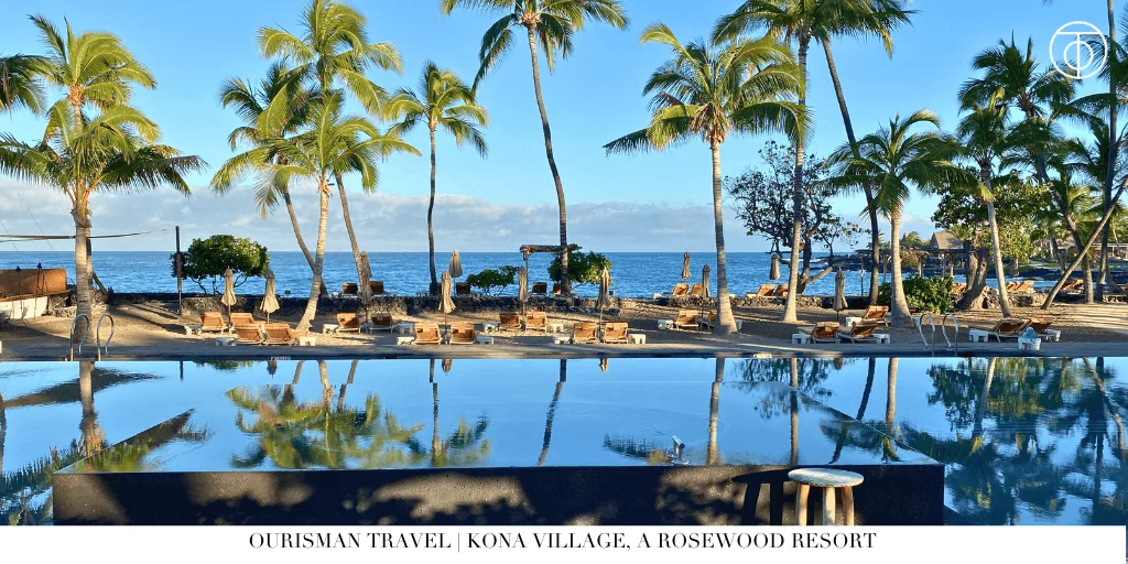 Oceanfront pool surrounded by palm trees at Kona Village a Rosewood Resort in Hawaii