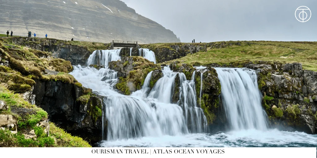 Multi-tier waterfall cascading over rocky cliffs in Iceland