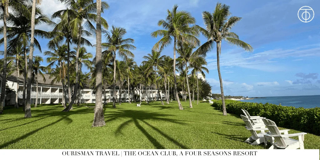 Palm tree lawn and oceanfront villas at The Ocean Club, A Four Seasons Resort