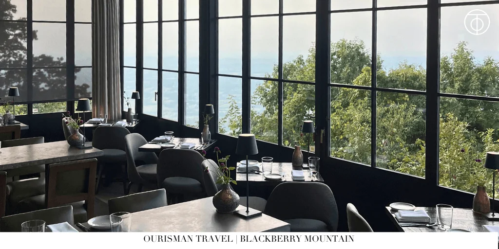 Dining room with floor-to-ceiling windows overlooking the mountains at Blackberry Mountain
