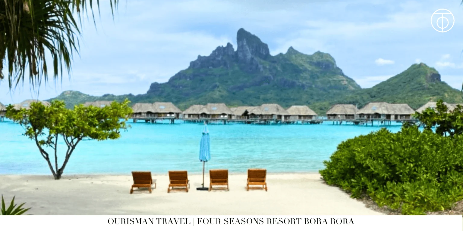 Four Seasons Bora Bora lagoon with overwater bungalows and mountain