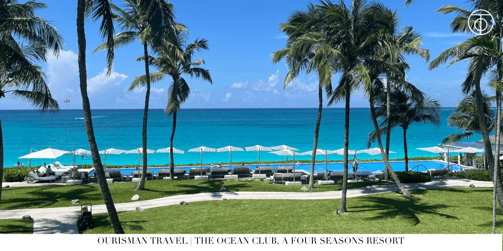 Oceanfront pool and palm trees at The Ocean Club, A Four Seasons Resort in the Bahamas