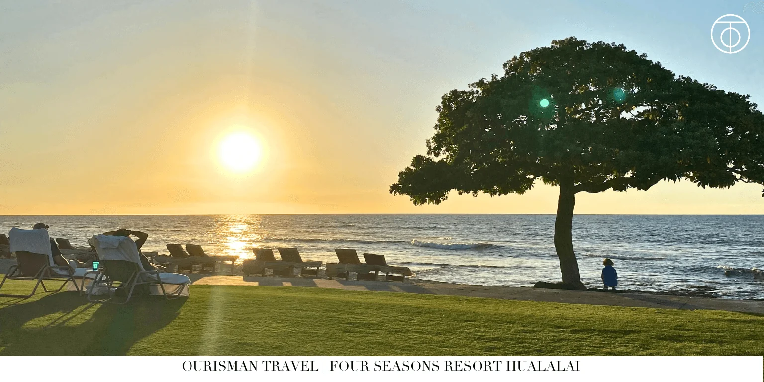 Four Seasons Hualalai beach sunset with lounge chairs Hawaii