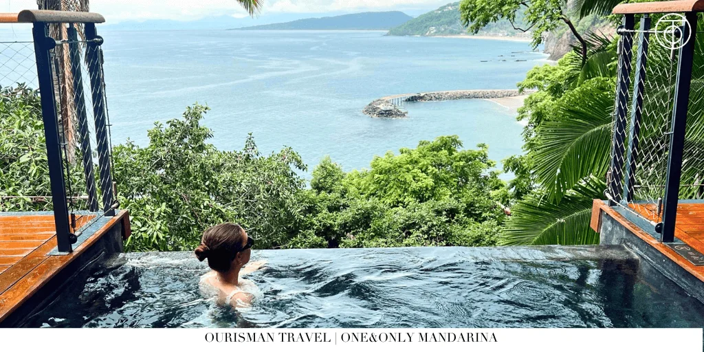 Guest relaxing in an infinity plunge pool overlooking the ocean at One&Only Mandarina in Mexico