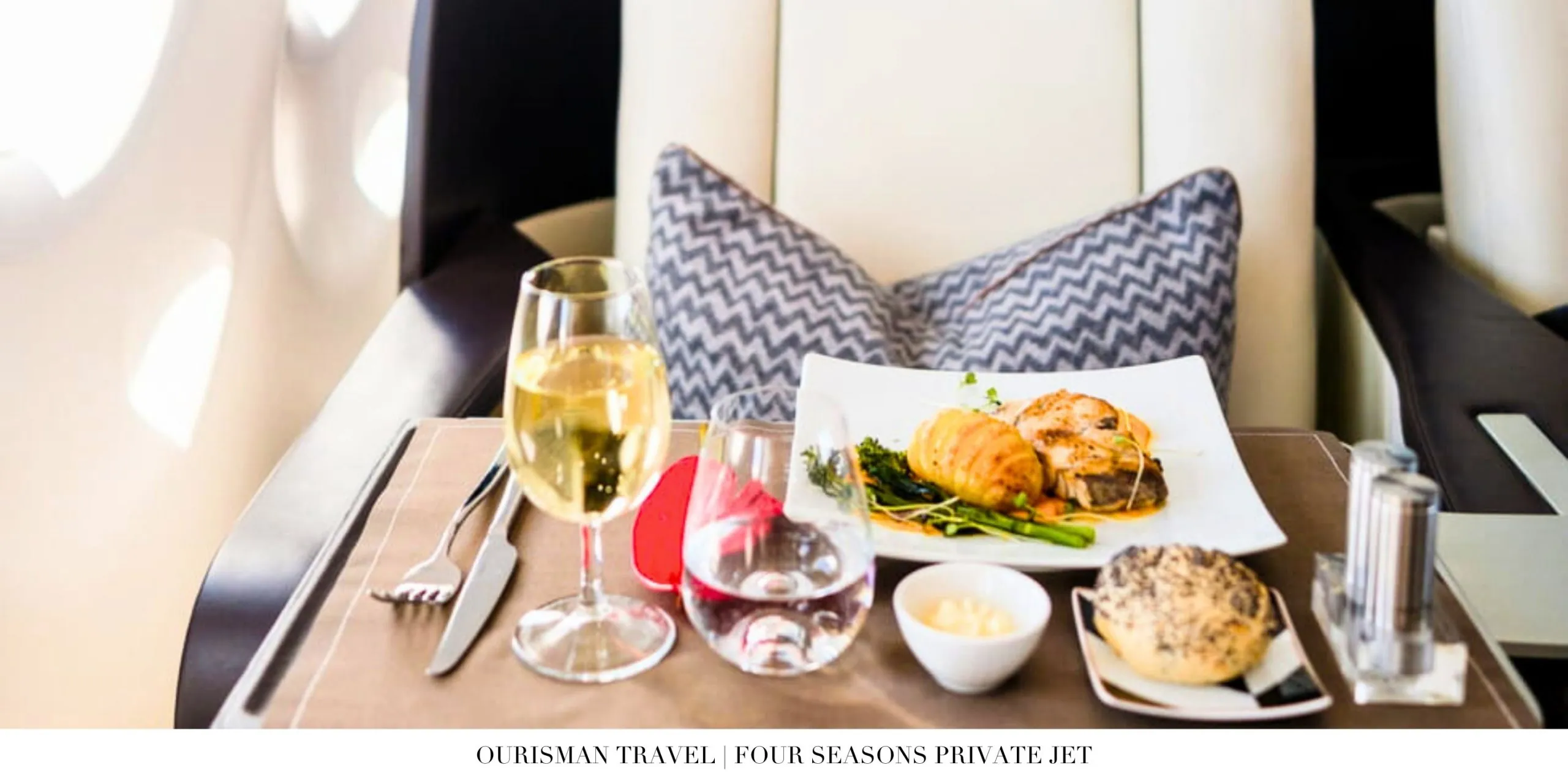 Gourmet meal service onboard the Four Seasons Private Jet