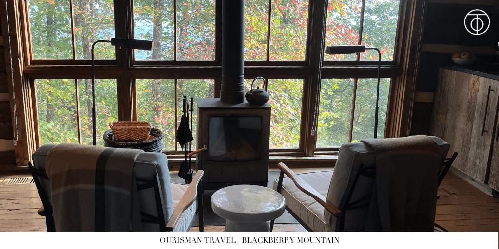 Living area with wood-burning stove at Blackberry Mountain Tennessee