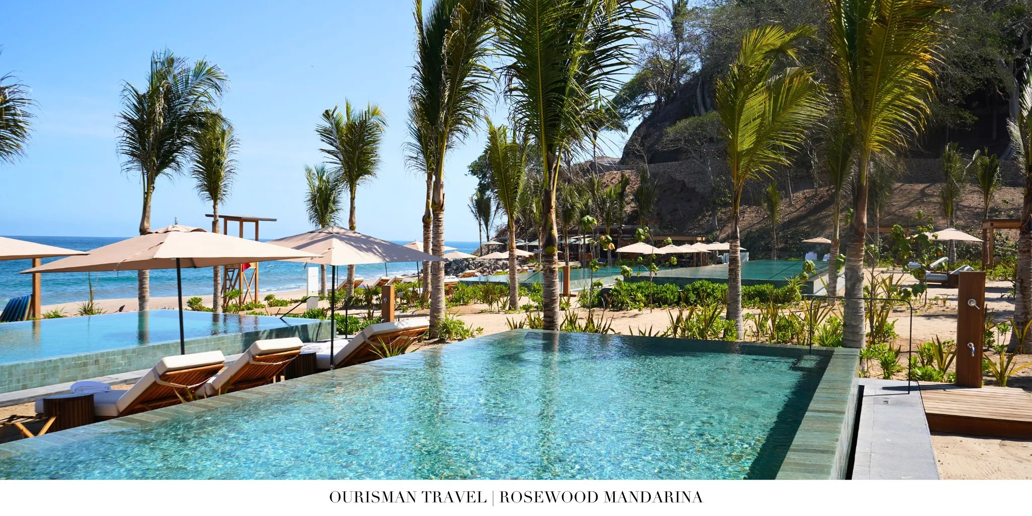 Rosewood Mandarina beachfront pool surrounded by tropical gardens and lounge areas