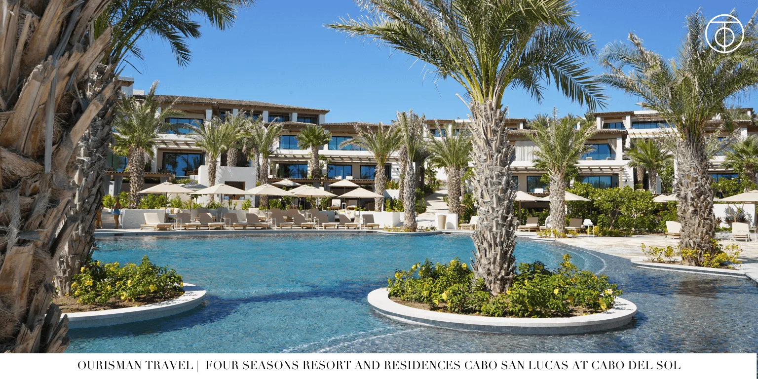 Resort pool at Four Seasons Cabo Del Sol with palm trees and lounge seating