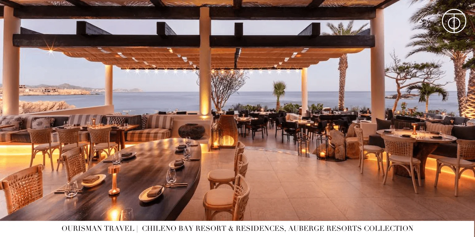 Outdoor dining space at Chileno Bay Resort overlooking the ocean