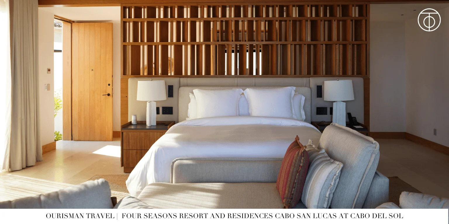 Guest room bedroom at Four Seasons Cabo Del Sol with wood detailing