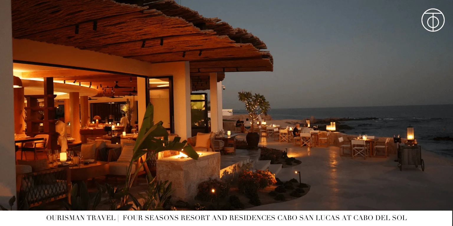 Outdoor dinner setup at Four Seasons Cabo Del Sol overlooking the ocean at sunset