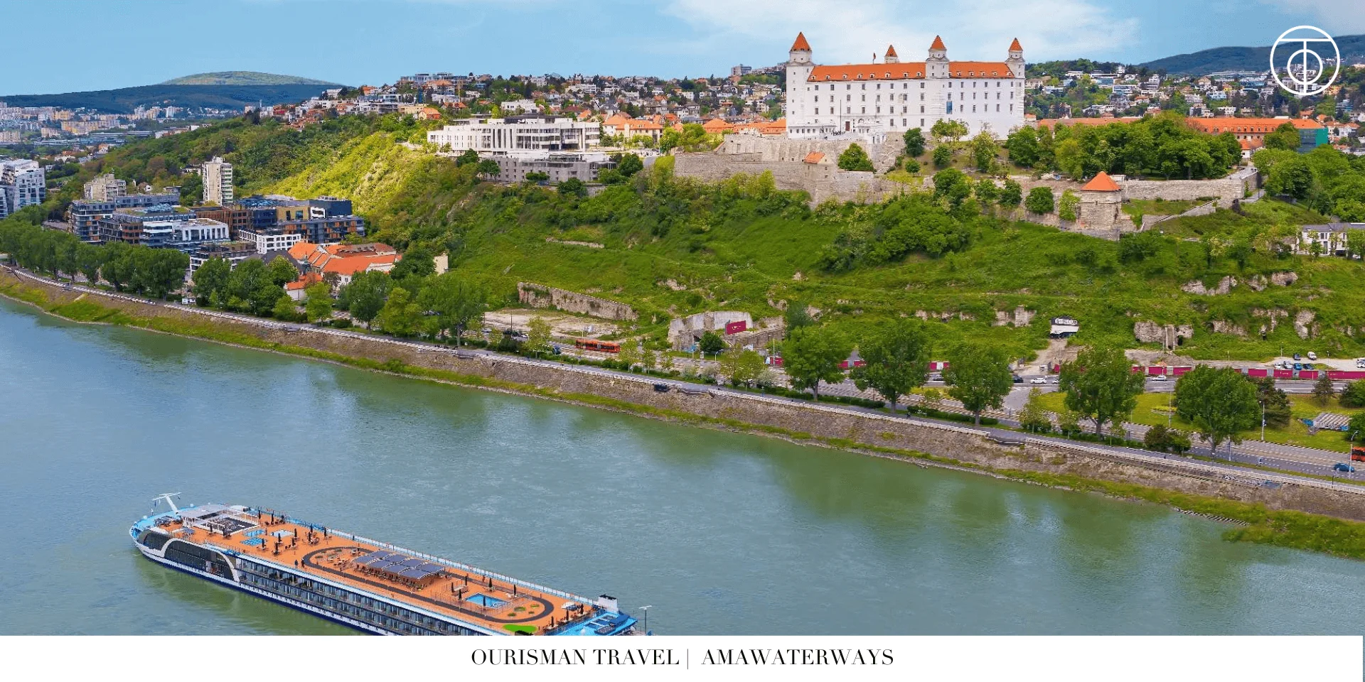 AmaWaterways river cruise ship sailing past a hillside town in Europe