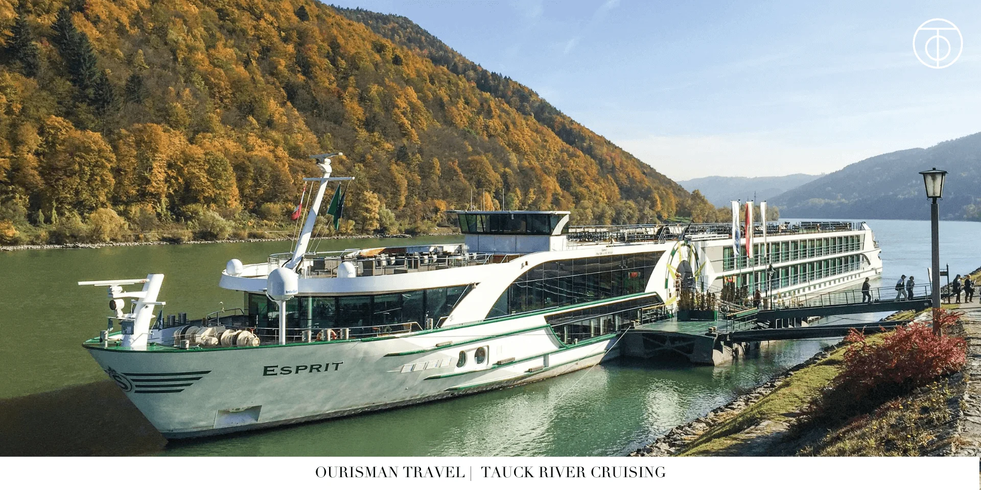 Tauck river cruise ship sailing past vineyards and hills along a European river