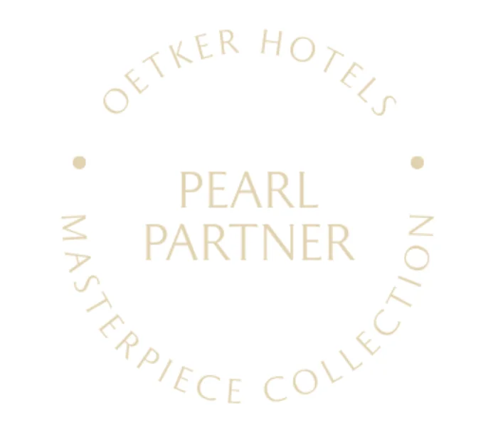 Oetker Pearl Partner logo representing preferred Oetker Collection travel advisors offering VIP amenities, daily breakfast, room upgrades, and exclusive privileges at Oetker Collection hotels worldwide