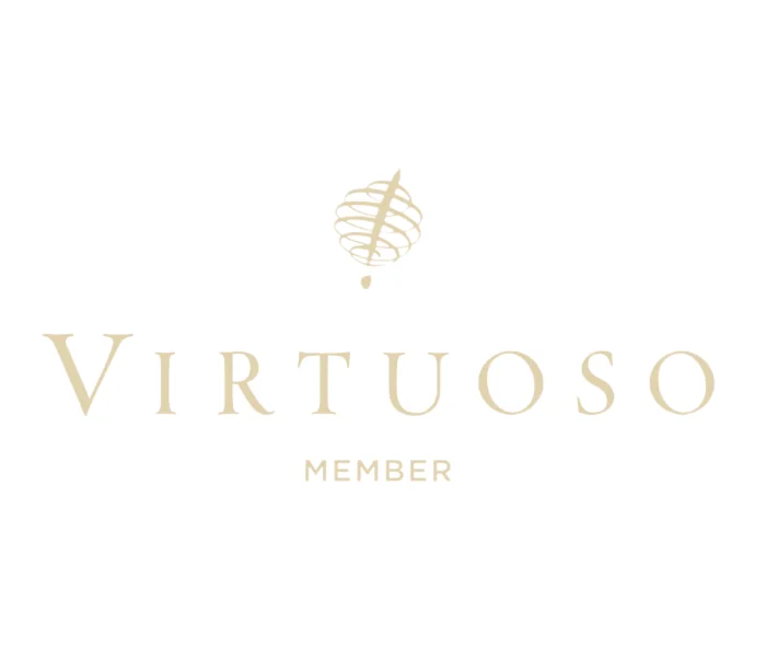 Virtuoso logo representing top Virtuoso travel advisors offering exclusive luxury hotel perks and VIP benefits worldwide